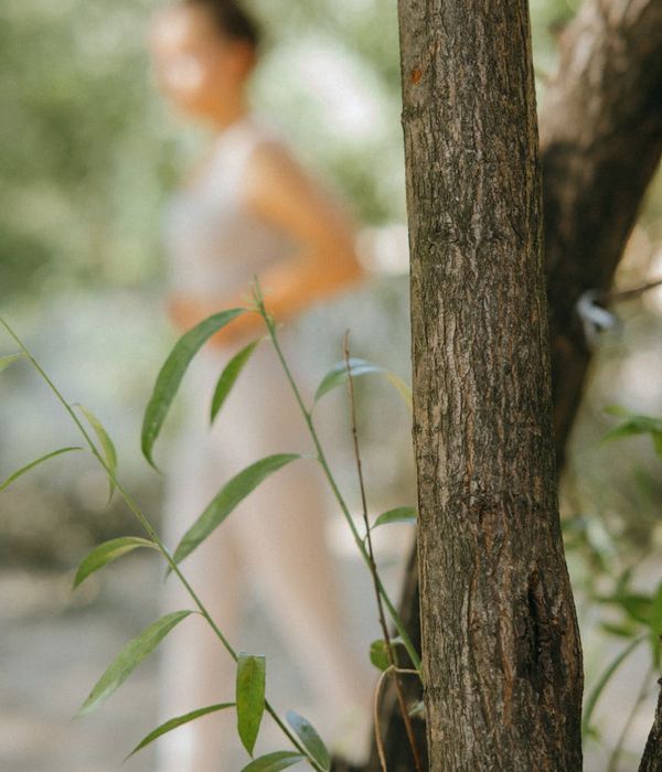 Woman in a serene yoga pose, embodying tranquility and balance.